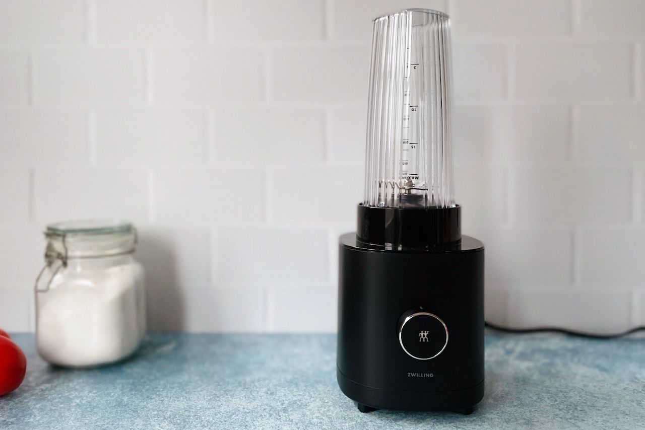 Zwilling blender on countertop with white tile background