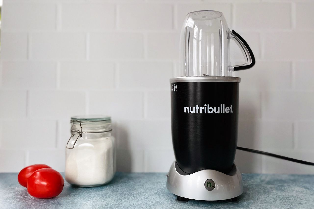 the nutribullet pro on a countertop with white tile background