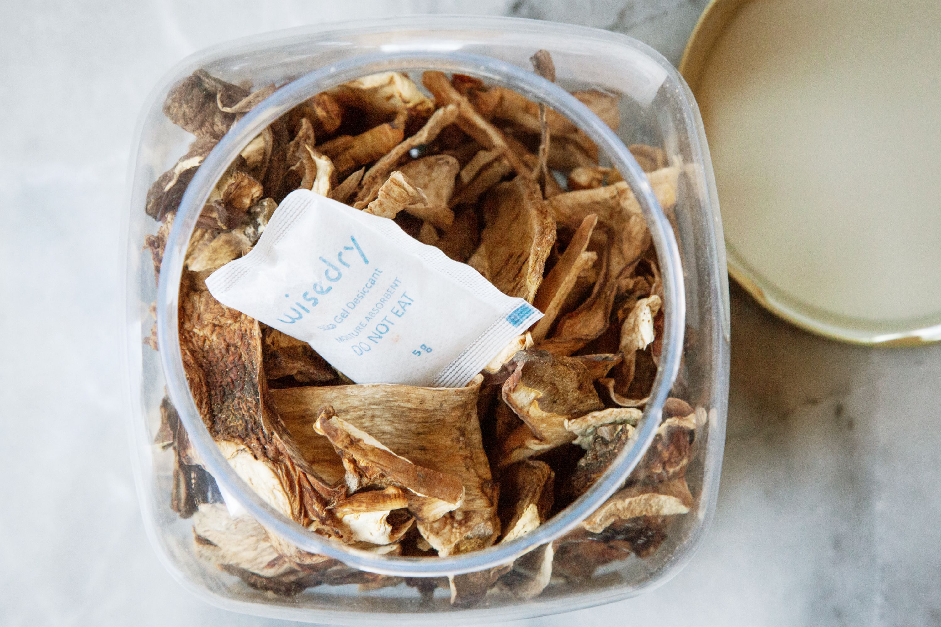 a desiccant pack in a jar of dried mushrooms