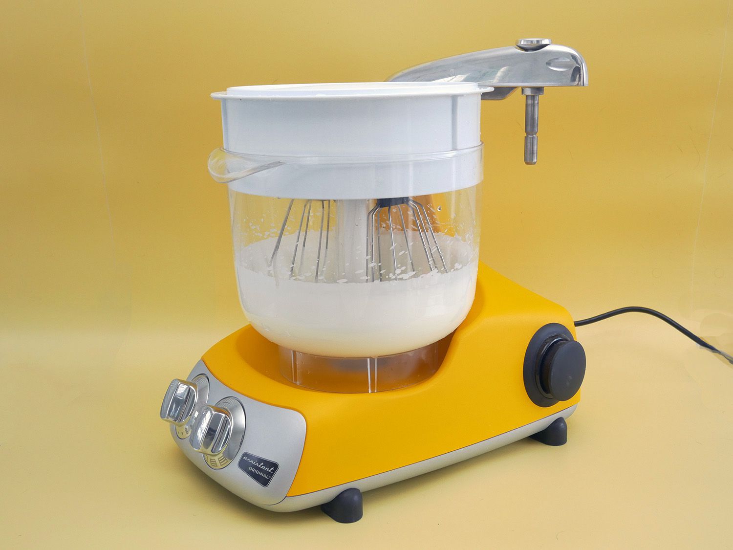 the ankarsrum with the plastic bowl and lid, with the beater attachment used to make whipped cream