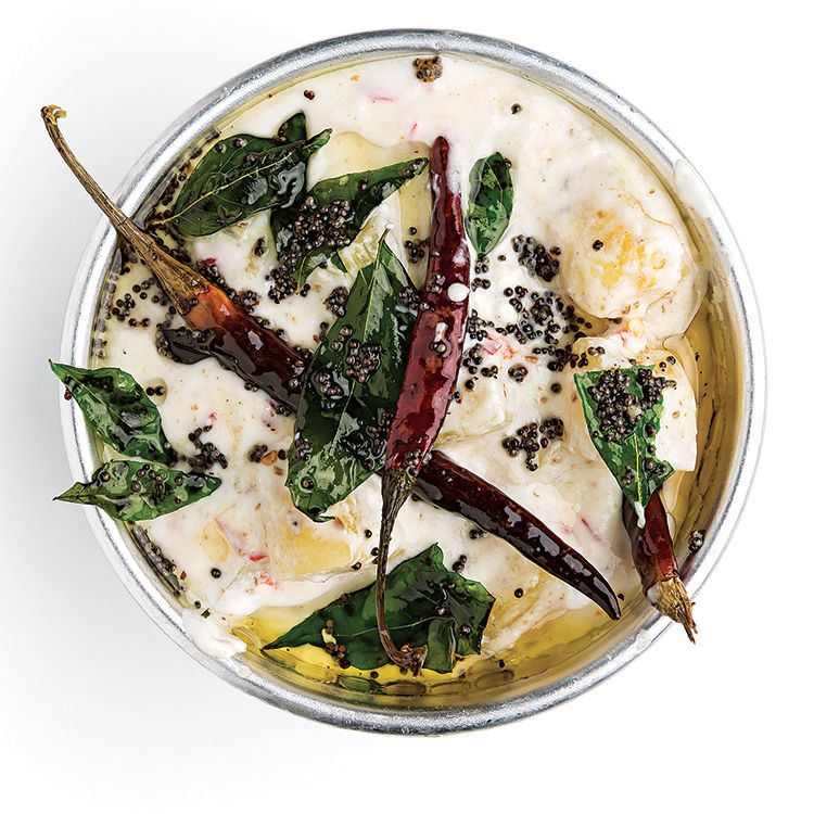 This zippy raita gets its punch from green Thai chiles and its sweetness from pineapple. A piquant mixture of black mustard seeds, dried red chiles, and curry leaves lends the sauce an earthy spice. Get the recipe for <a href="https://www.saveur.com/article/recipes/kaitha-chaka-pachadi-spicy-pineapple-yogurt/">Kaitha Chaka Pachadi (Spicy Pineapple Yogurt)</a>