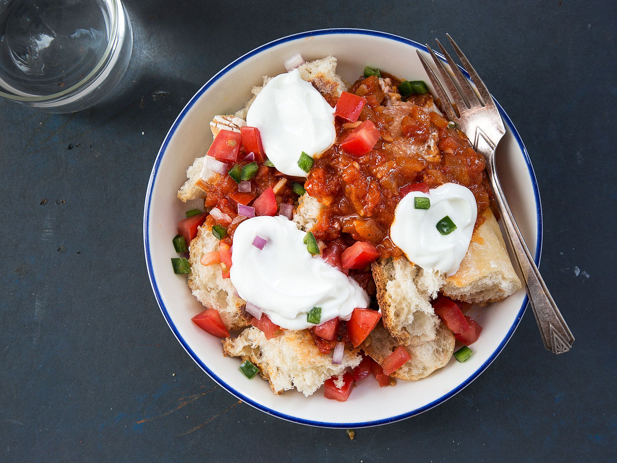 In the Horn of Africa, they serve a version of panzanella tossed not with fresh tomatoes, but with a rich, spicy tomato stew. Crusty bread soaks up the juices and cooling yogurt provides contrast and sweet relief. Get the recipe for <a href="https://www.saveur.com/eritrean-spicy-tomato-bread-salad-fata-recipe/">Eritrean Spicy Tomato Bread Salad with Yogurt (Fata)</a>