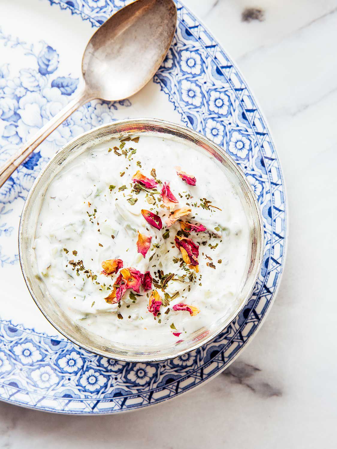 The use of roses—petals and waters flavored with them—is common in Persian and Middle Eastern kitchens. Naz sprinkles the petals atop this tart, cooling yogurt sauce she serves with crispy rice dishes, and often with stews and meats. Get the recipe for <a href="https://www.saveur.com/yogurt-cucumber-sauce-with-roses-recipe/">Yogurt Cucumber Sauce with Rose Petals (Maast-o Khiar)</a>