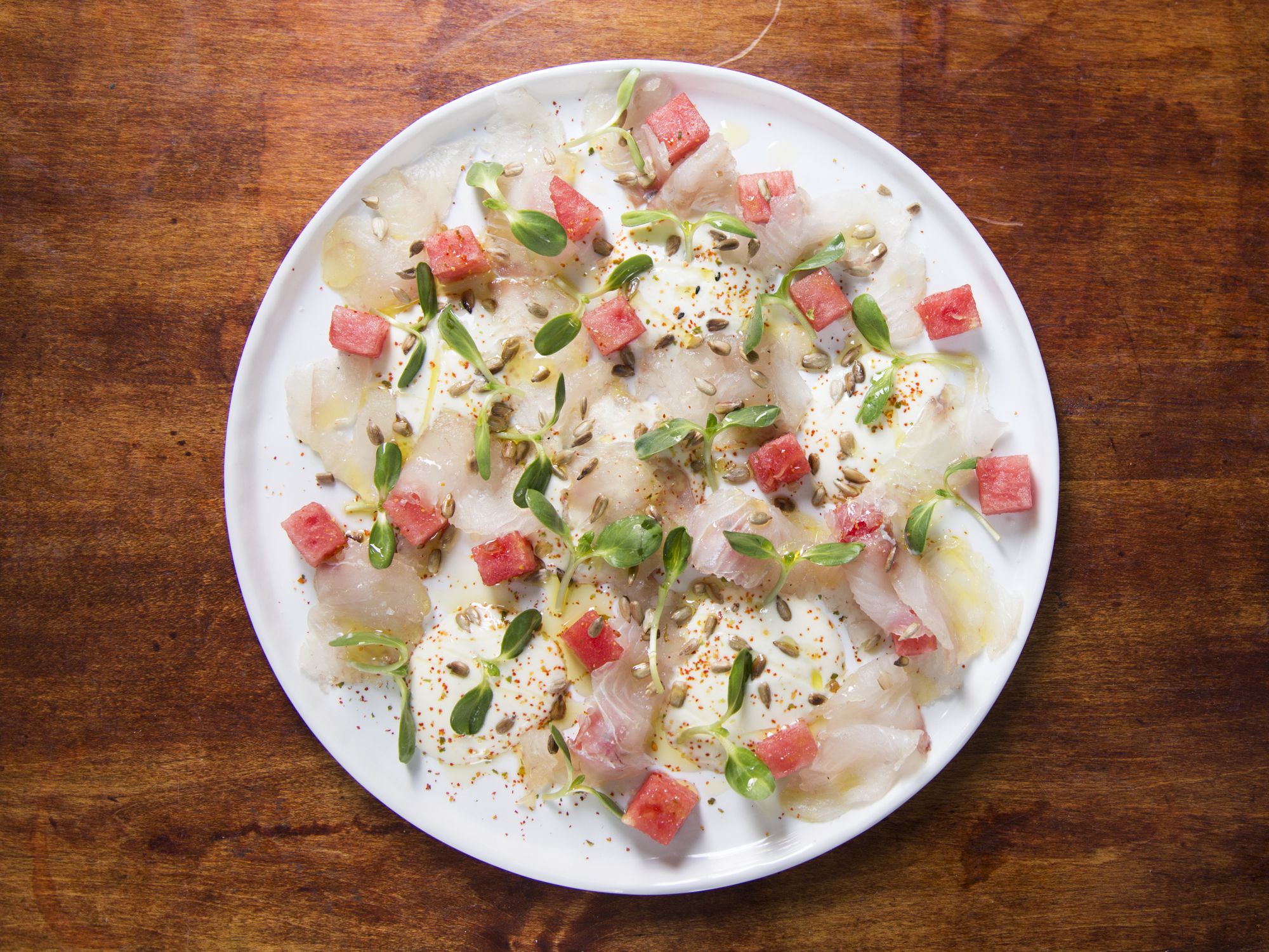 Breakfast, brunch, or snack, we could serve (and eat) this quick-cured, no-cook fish dish from John Karangis of Union Square Events, any time of day. It works exceptionally well as a summer starter, served with a savory lime yogurt and refreshing cubes of ripe watermelon, then sprinkled with flecks of shichimi togarashi: a spicy, tangy, earthy Japanese spice mix. Get the recipe <a href="http://www.saveur.com/cured-fluke-yogurt-watermelon-sunflower-seeds-and-togarashi-recipe">Cured Fluke with Yogurt, Watermelon, Sunflower Seeds, and Togarashi)</a>