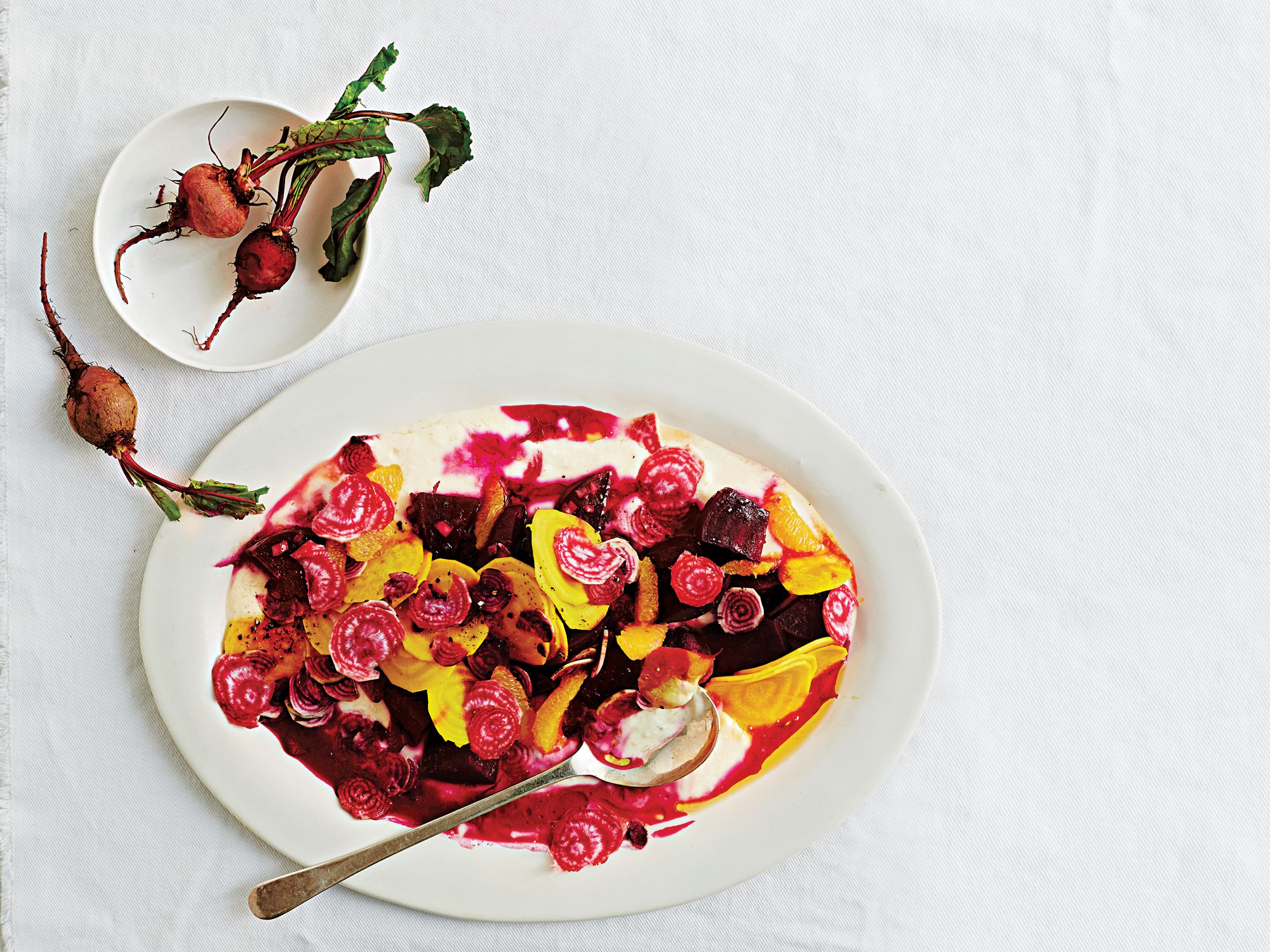 In this bold salad, roasted, pickled, and raw beets tangle with a creamy orange–yogurt dressing. Get the recipe for <a href="http://www.saveur.com/three-beet-salad-with-orange-yogurt-dressing-recipe">Three-Beet Salad with Orange-Yogurt Dressing</a>