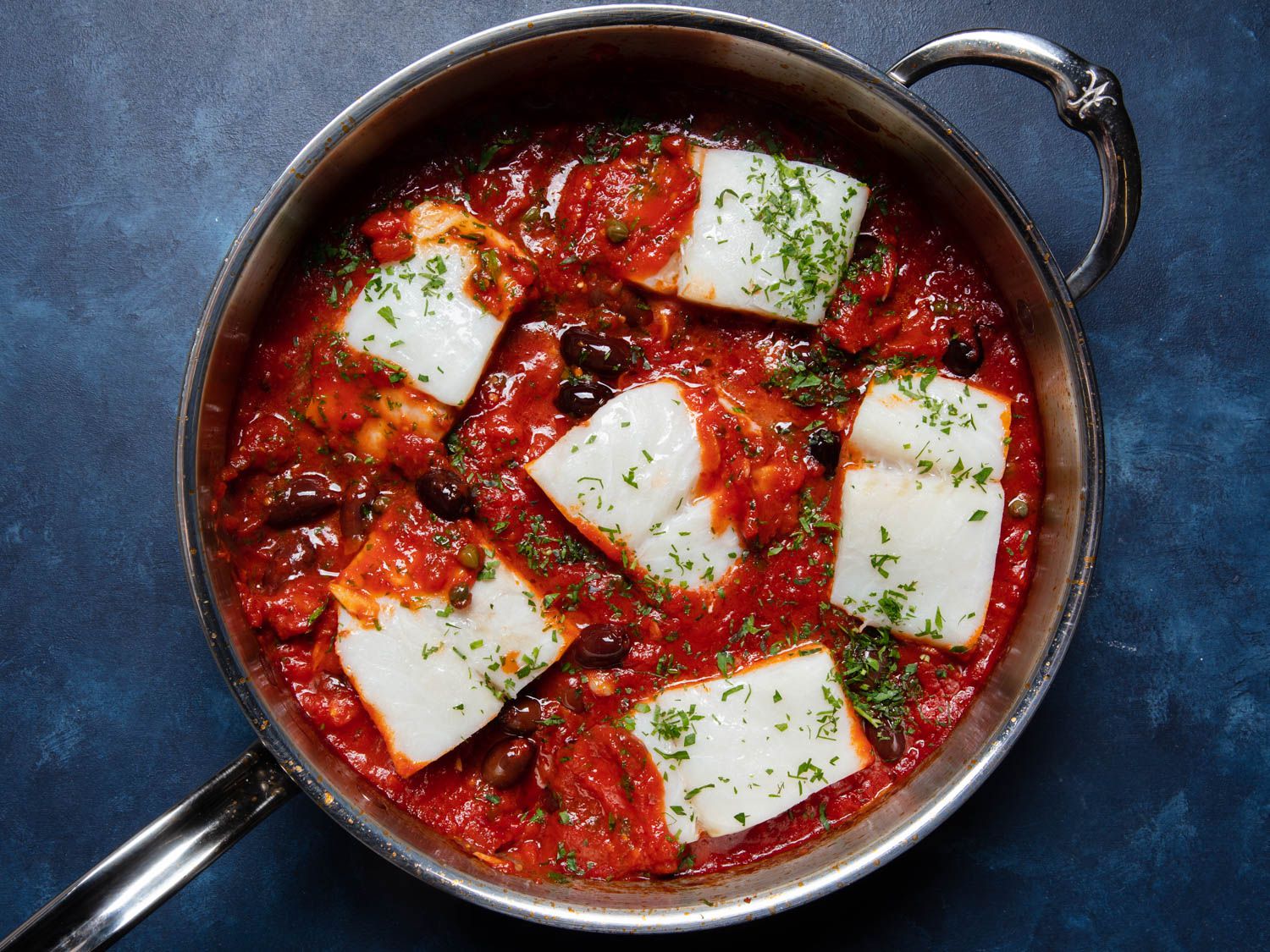 Overhead of a skillet of baccalÃÂ  alla napoletana.