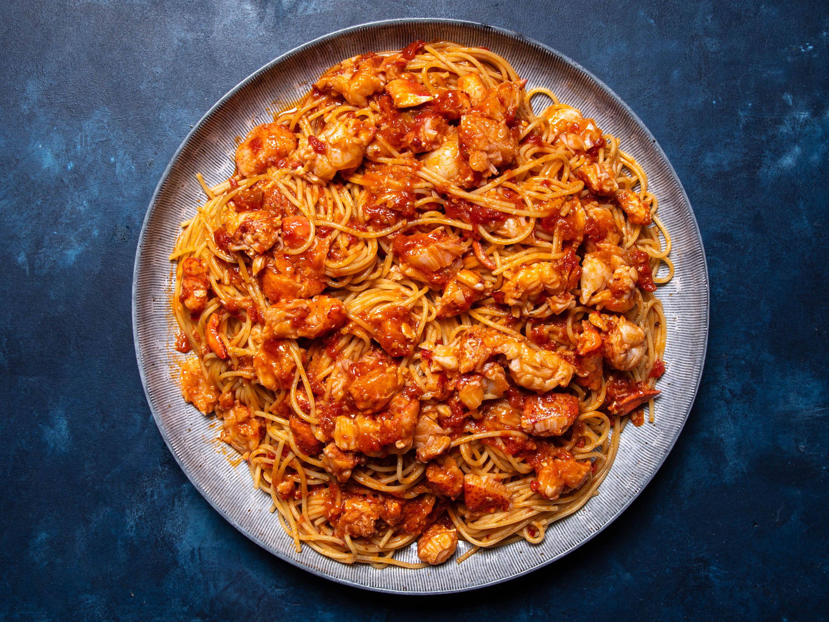 The lobster fra diavolo on a serving plate, before the breadcrumbs go on