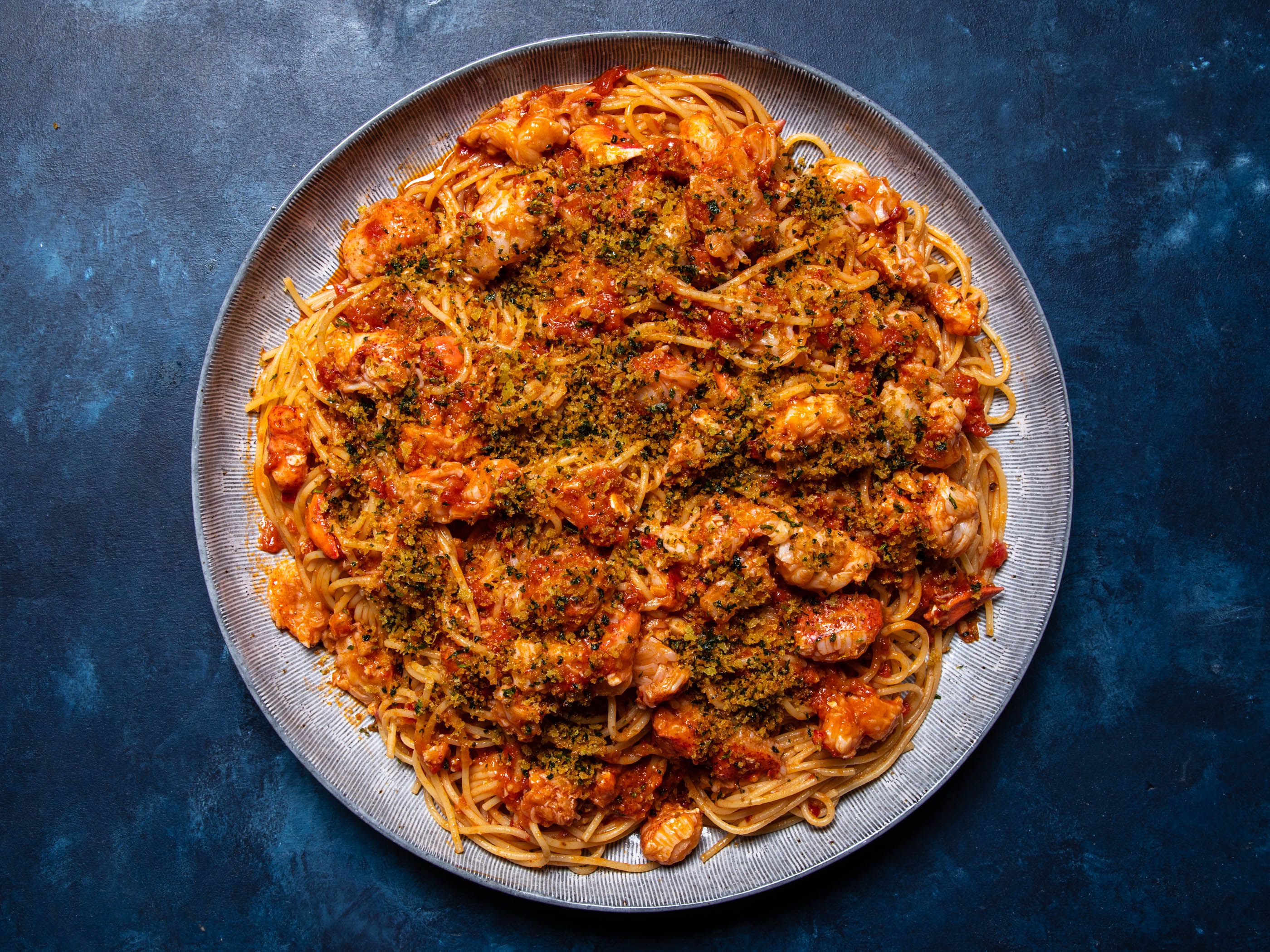 Lobster fra Diavolo on a blue tablespread.