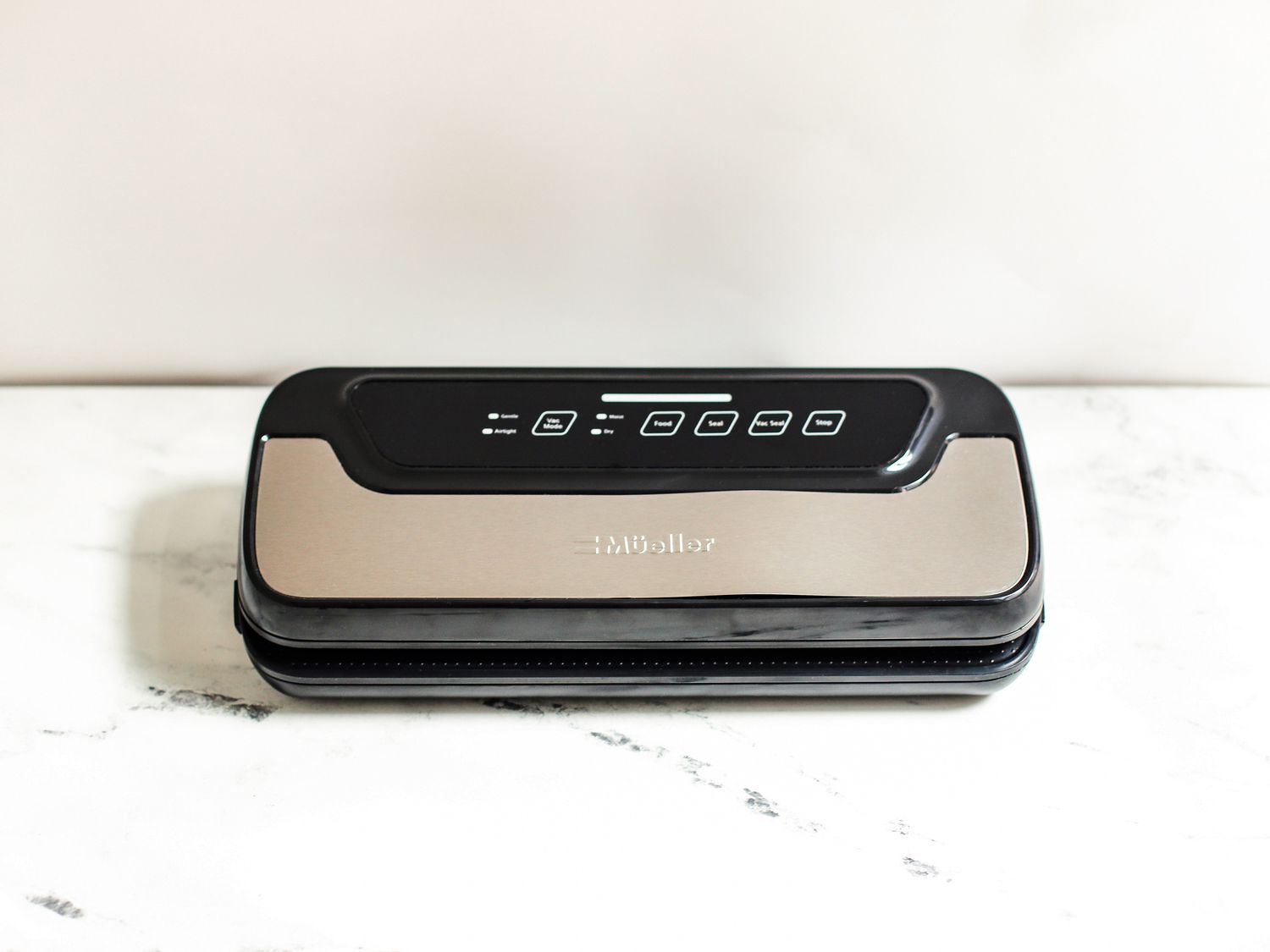 Mueller vacuum sealer on a marble countertop