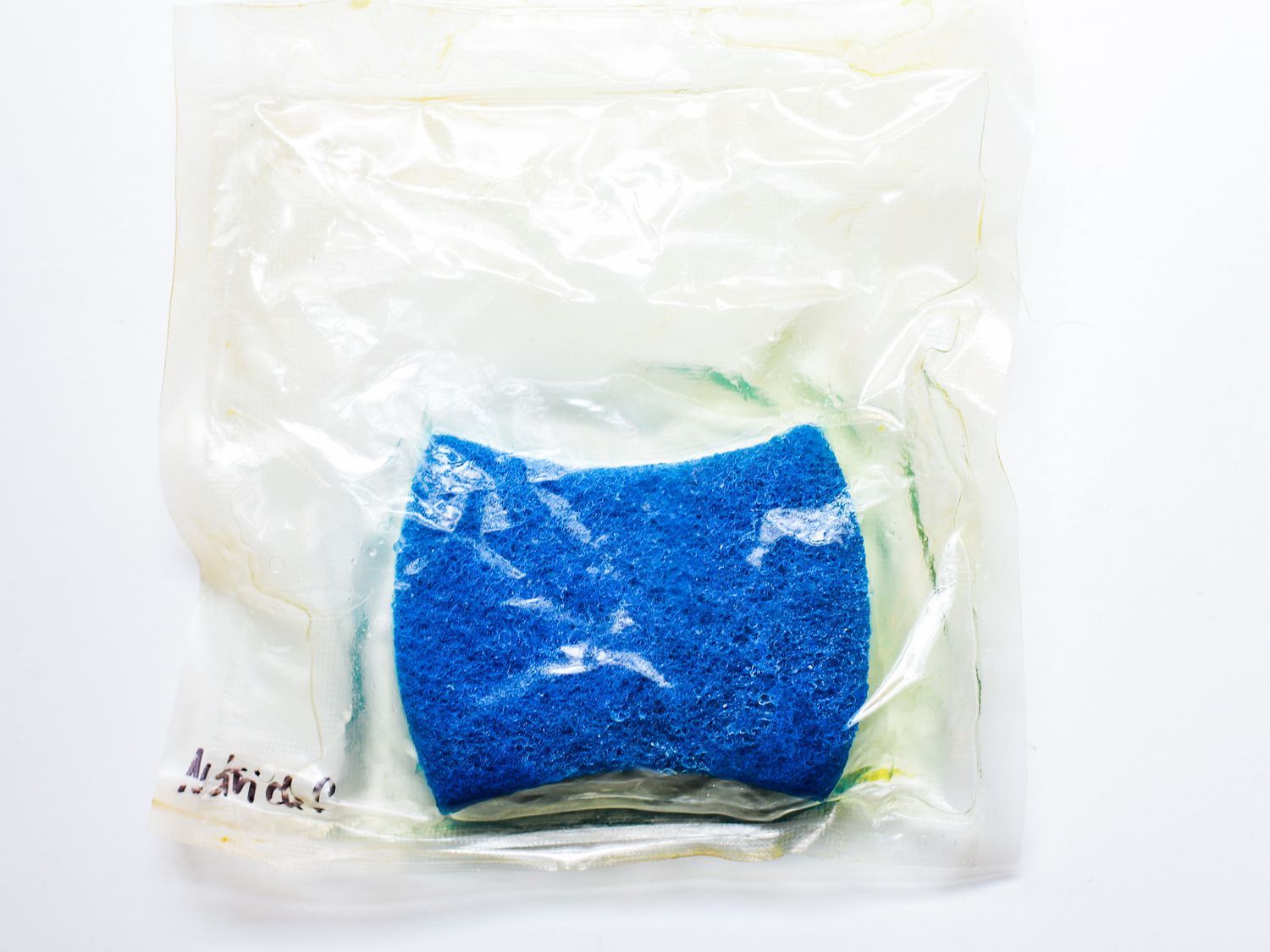 A sponge in a vacuum sealed bag whose seal has broken