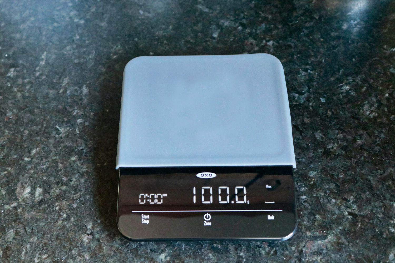 the oxo scale on a granite countertop