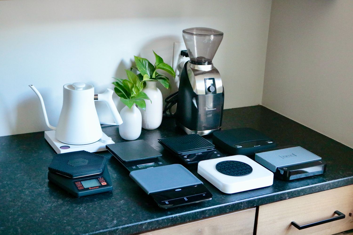 A number of coffee scales on a countertop