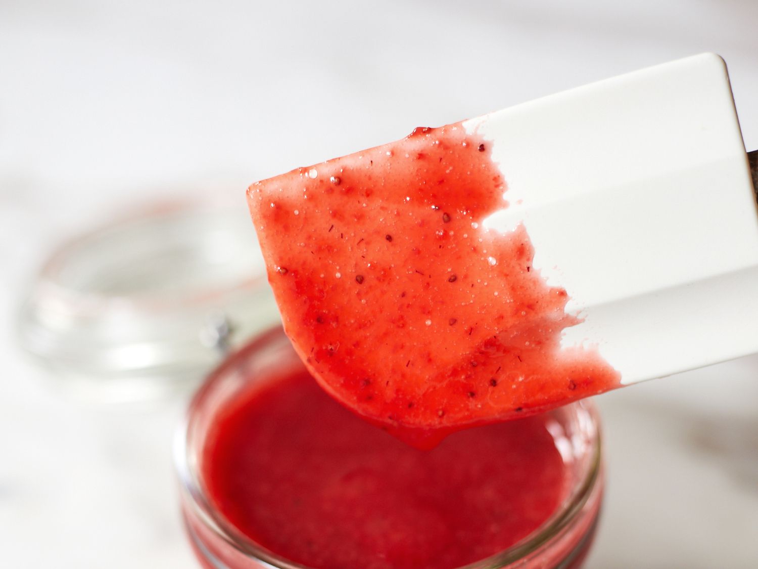 an up close look at a too seedy strawberry sauce