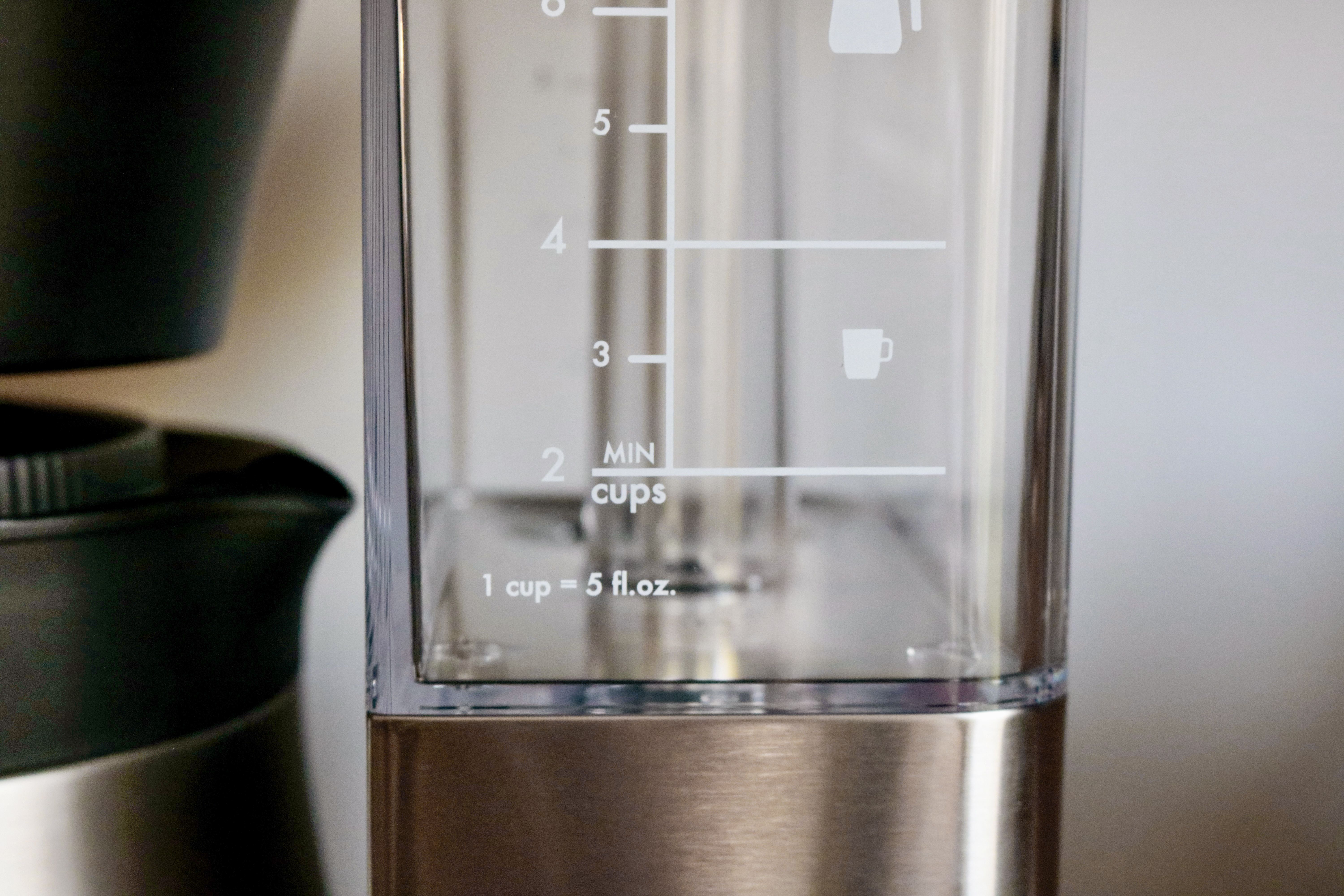 a closeup look at a coffee maker's empty water reservoir