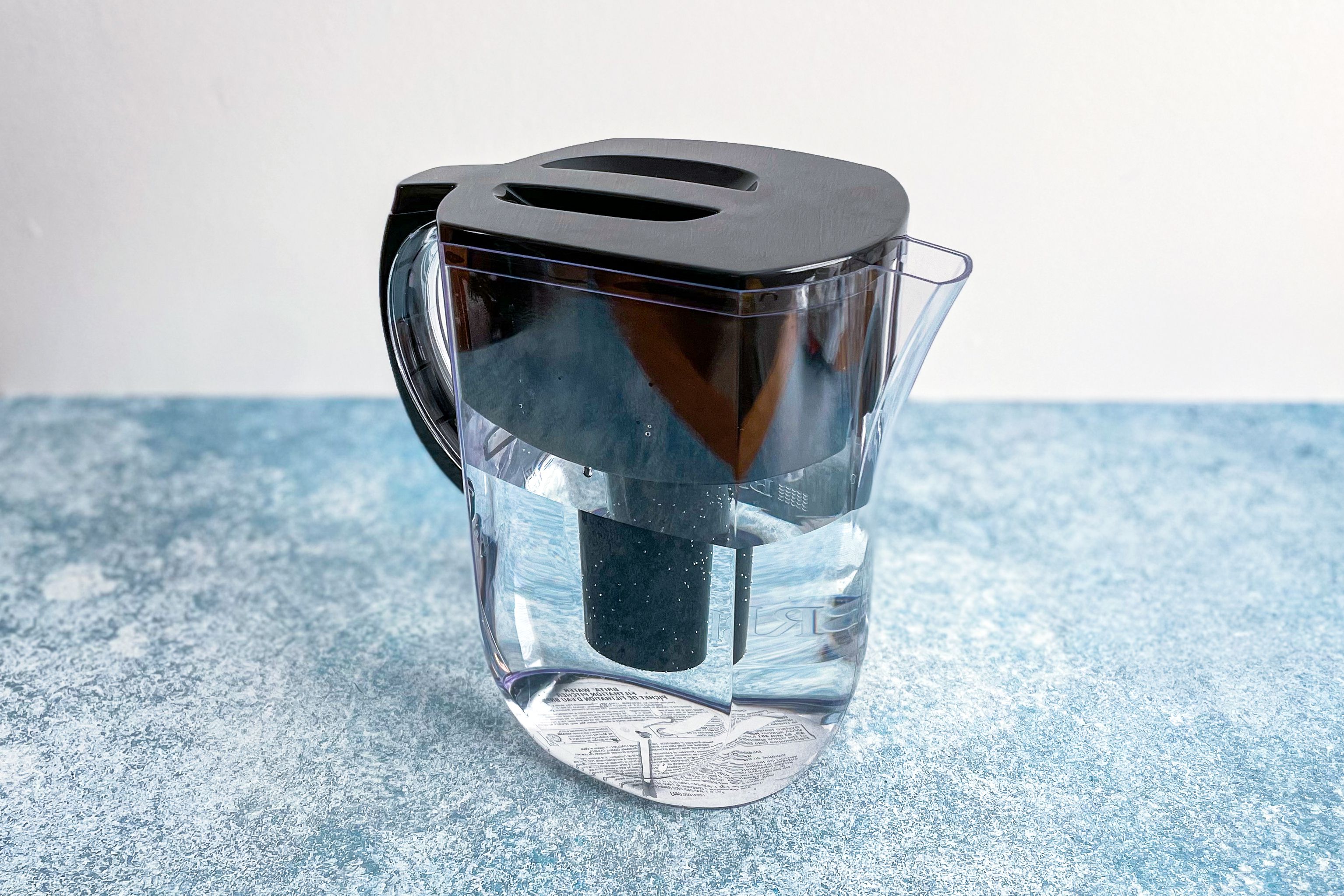 the brita pitcher on a blue surface