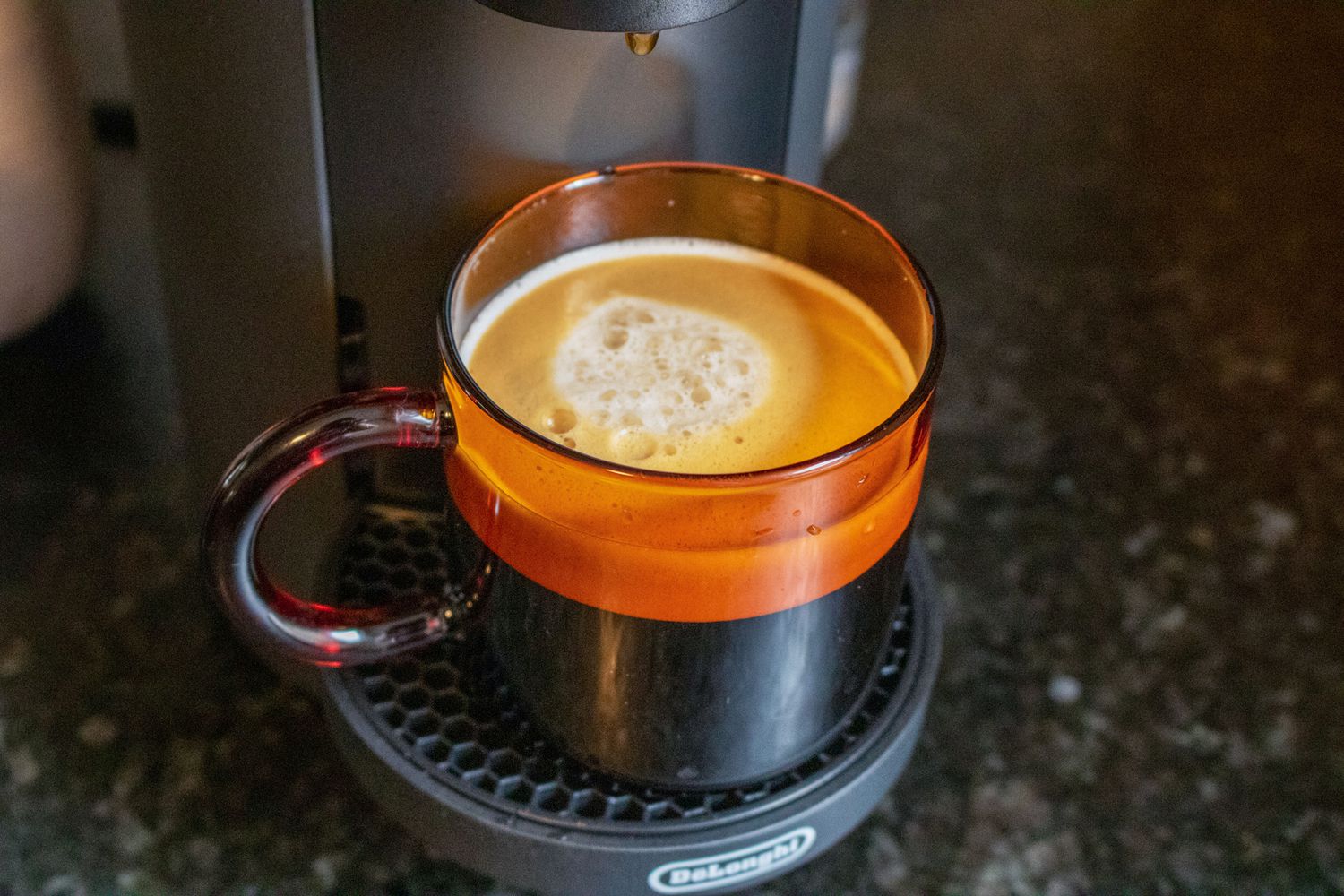 Coffee from a Nespresso in an amber colored mug
