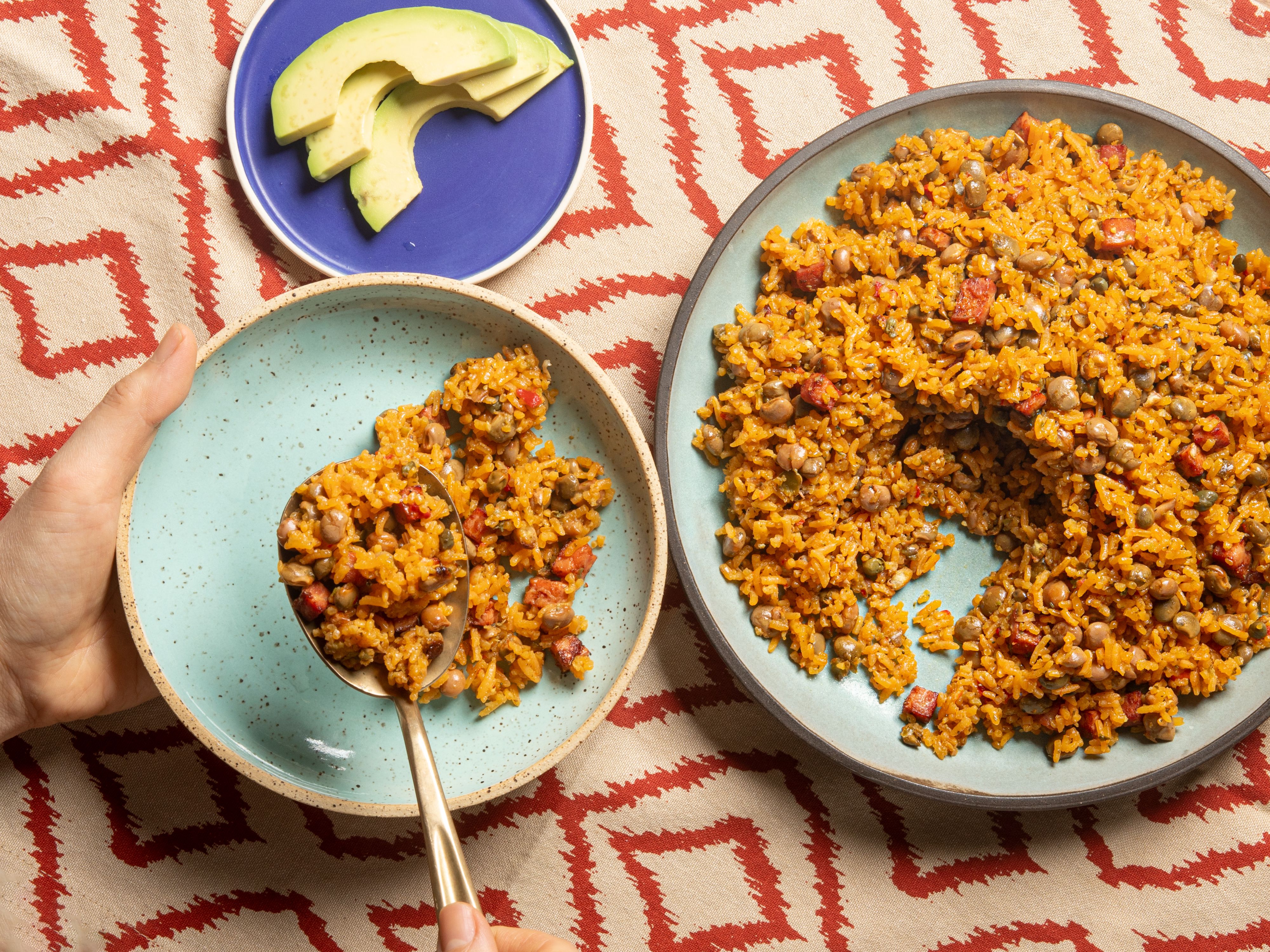 Overhead view of someone serving arroz con gandules