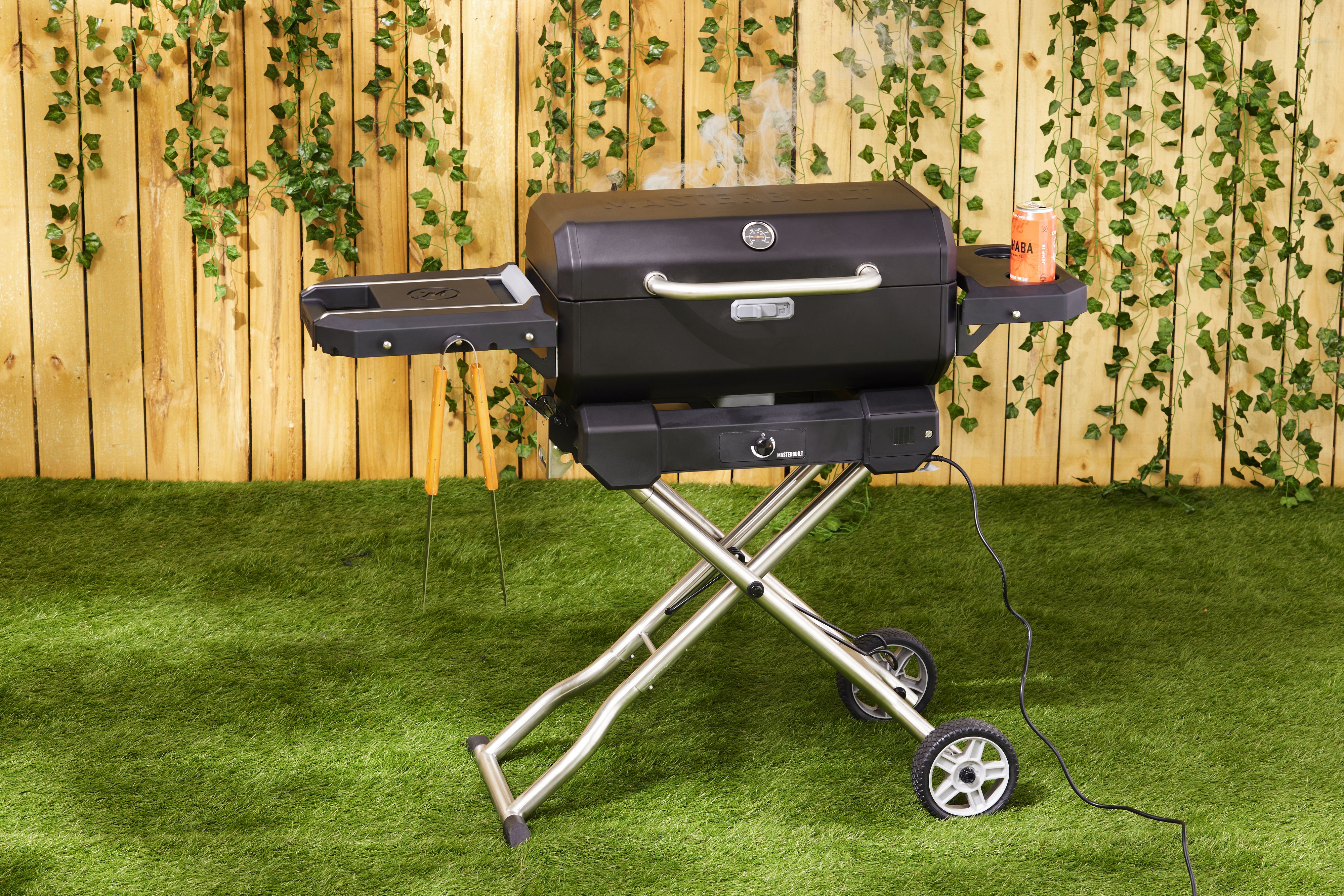 A portable charcoal grill with its lid closed